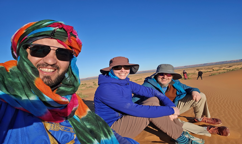 People taking a selfie in the Moroccan desert