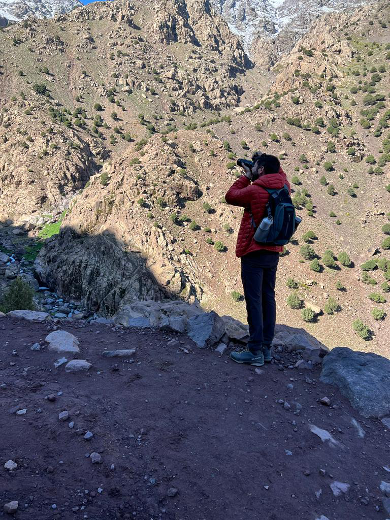 A nature photographer capturing the beauty of Mount Toubkal.