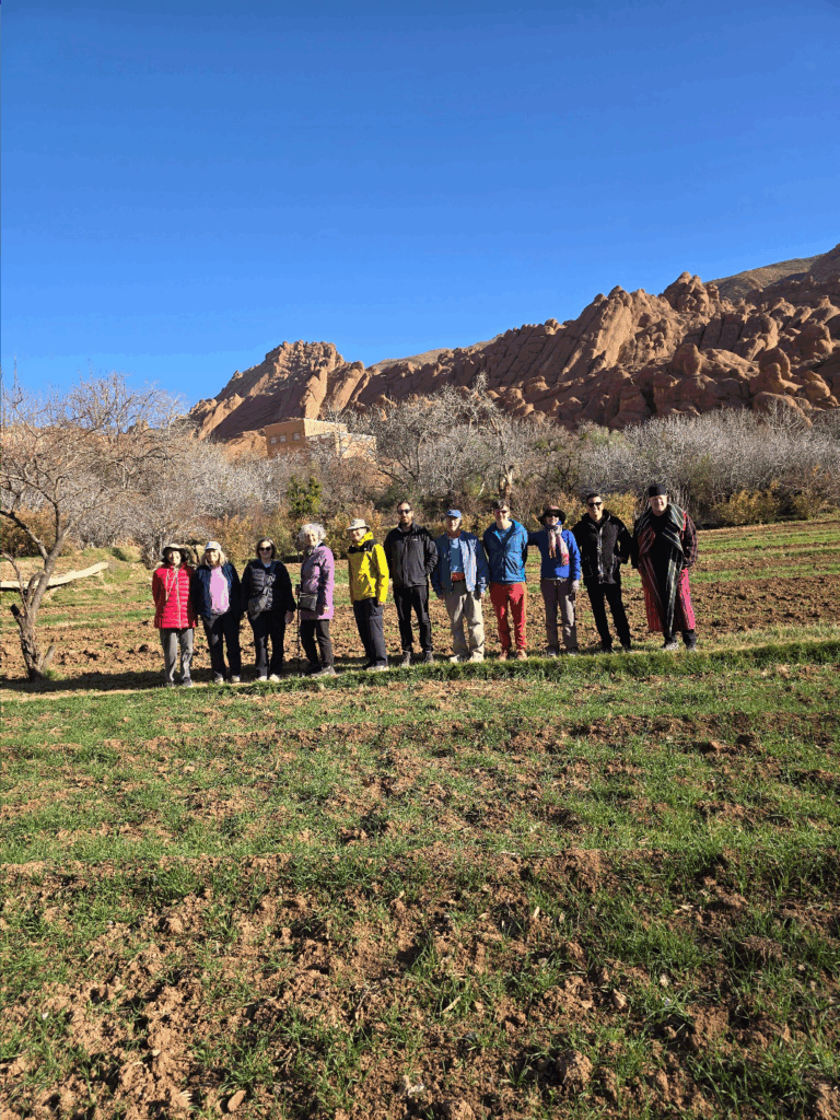 A group of people posing in a field