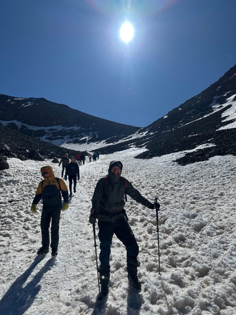 People trekking through a snowy mountain