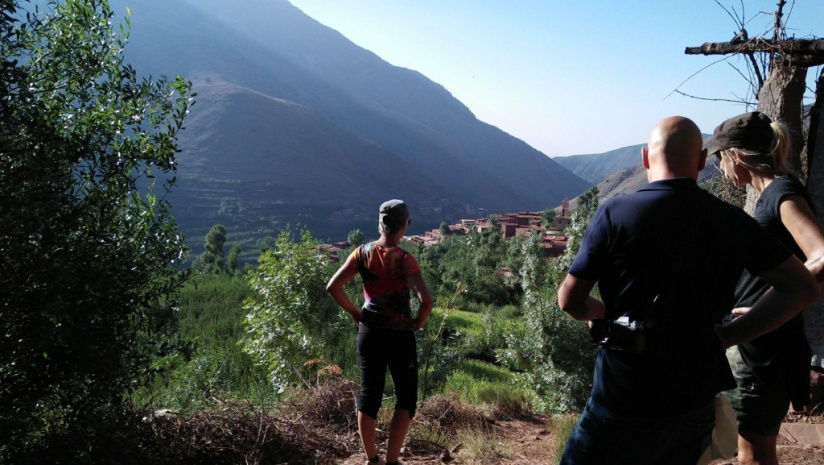 A group of trekkers standing after a hike overl