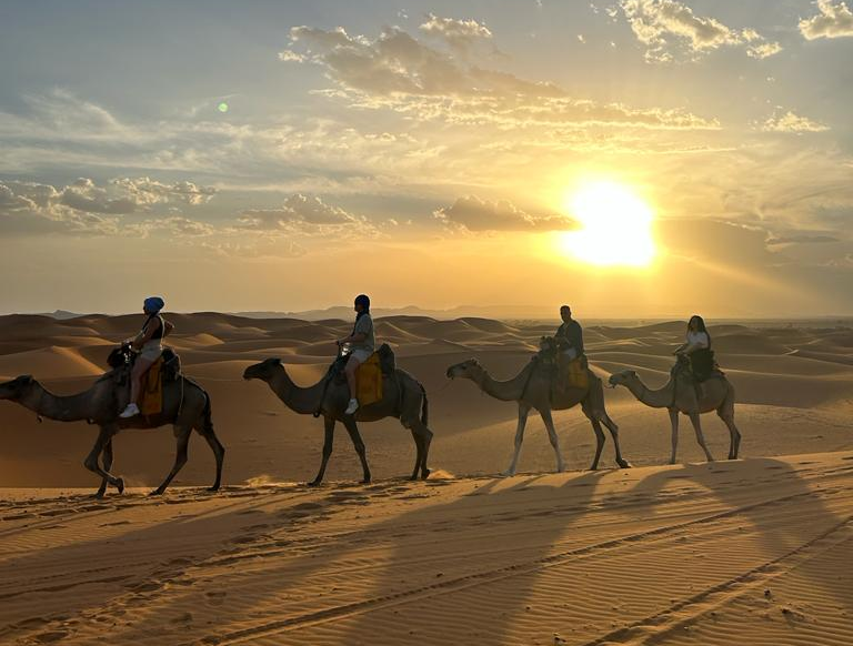 Group of tourists riding camels