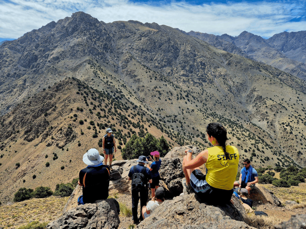 people in a group resting during a hike