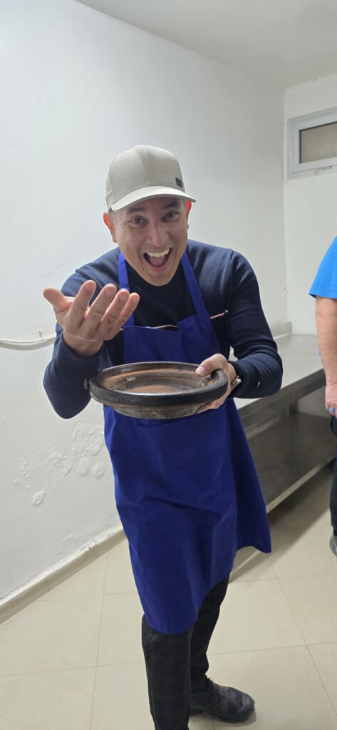A man holding a ceramic bowl
