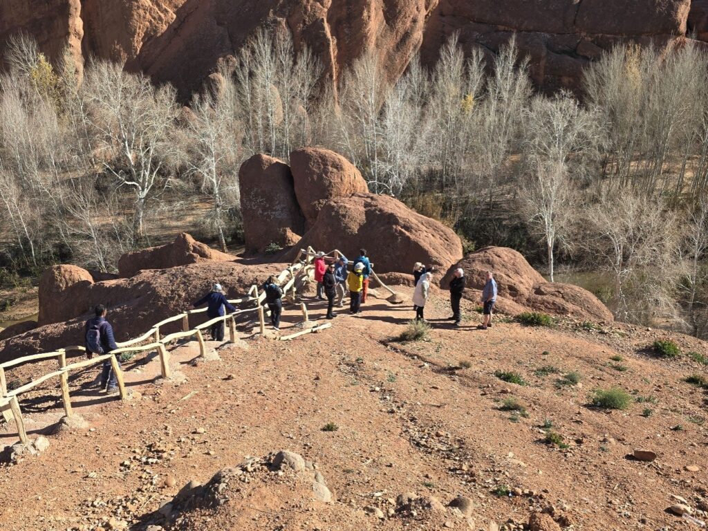 People standing near large rocks