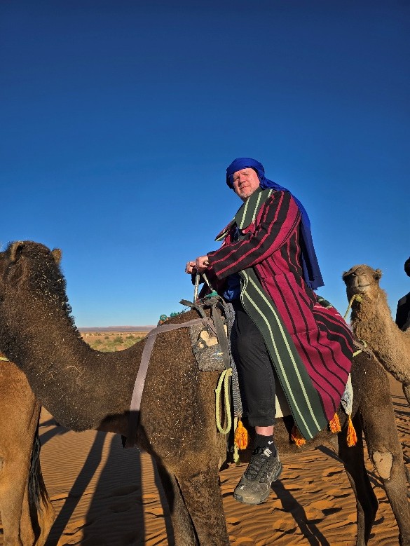 A person riding a camel