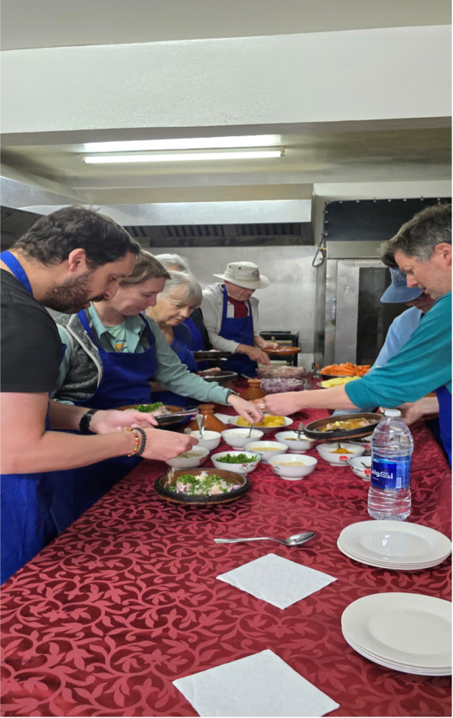 People standing around and eating food