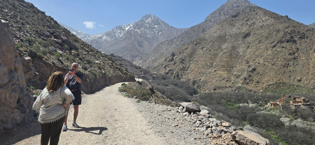 Tourists on a trek with a mountain in the background
