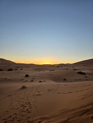 A picture of sand dunes in the Sahara Desert.