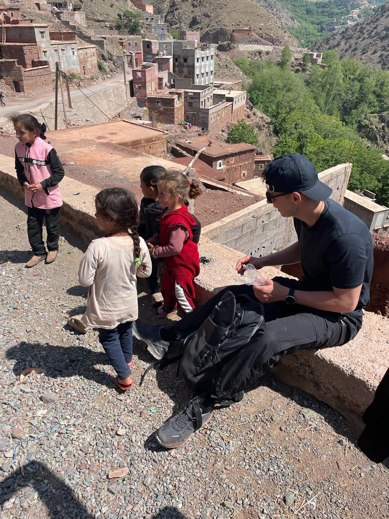 A tourist interacting with local children.c